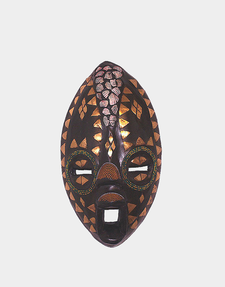 This oblong shaped African ceremonial mask has cowrie shells around its forehead. Ceremonial masks play an important role in traditional African rituals.