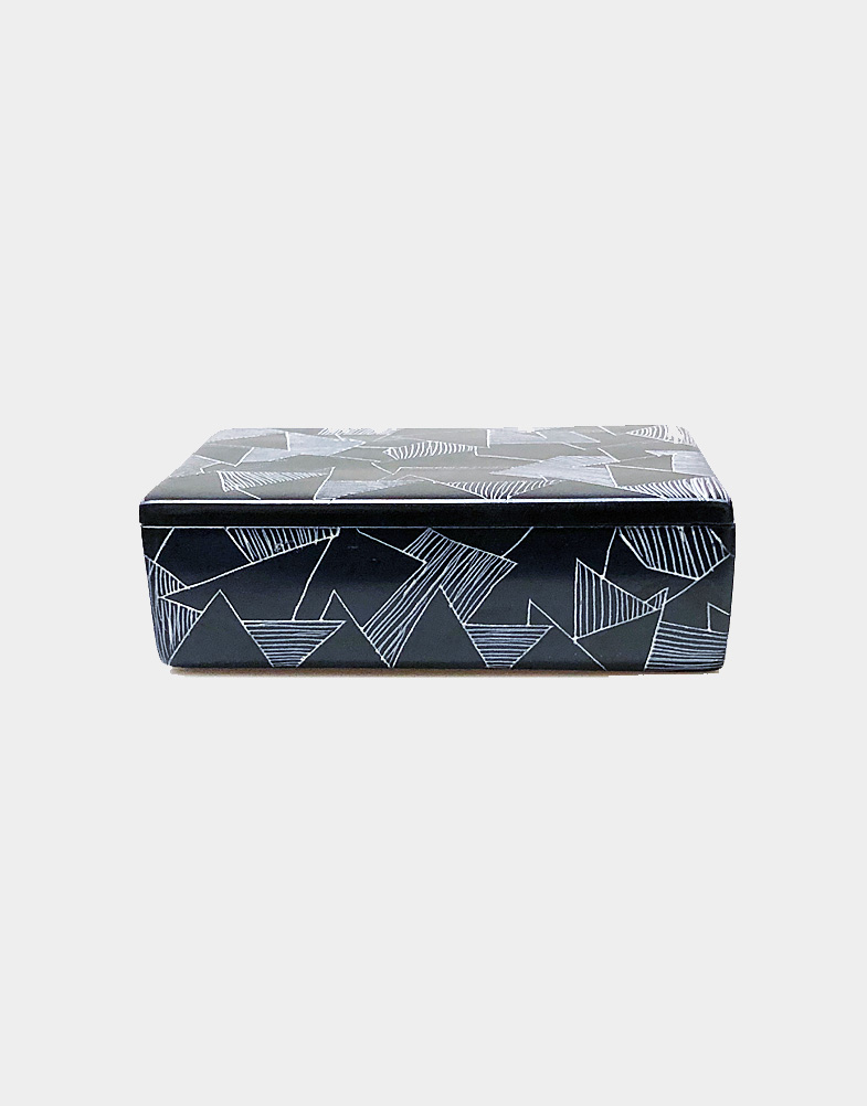 Kenyan artisans hand carve soft soapstone to create a simple rectangular box, then dye the exterior repeatedly to achieve a deep black finish. Free shipping