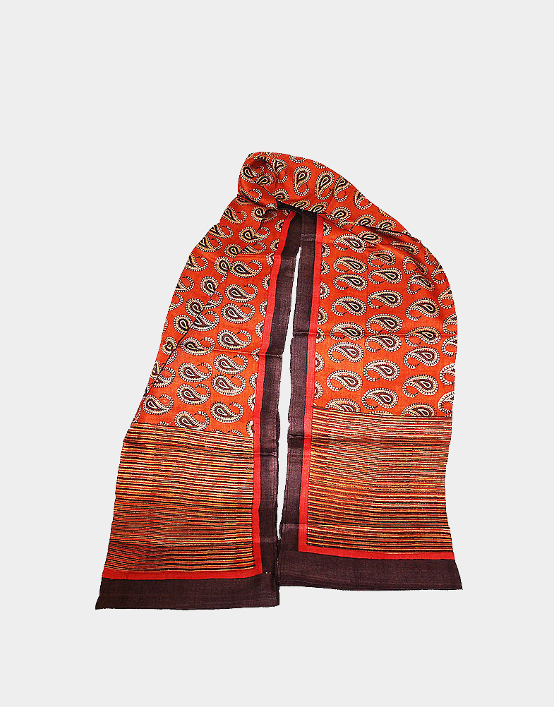 This orange silk scarf is made of Tassar silk with traditional Indian kalka block printed across the body. It has striped borders on both end. Free shipping.