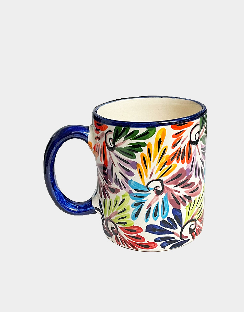 Artisan Pedro Alba of Mexico hand crafted these cups with floral motifs and trimmed in dark blue. These cups are lead free, microwave and dishwasher safe. Buy now