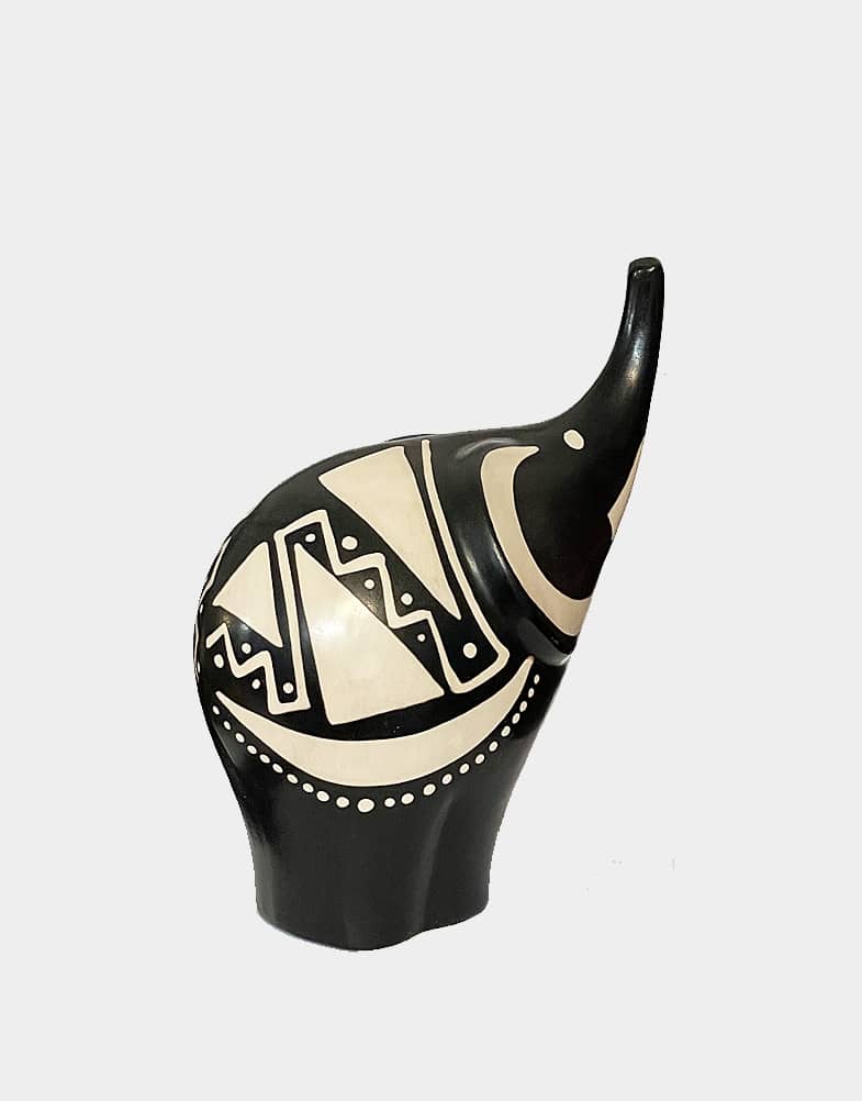 This good luck trunk up elephant Peruvian pottery is made by an artist from Chulucanas, Peru and is fully handcrafted in black and creamy white color. Shop now.
