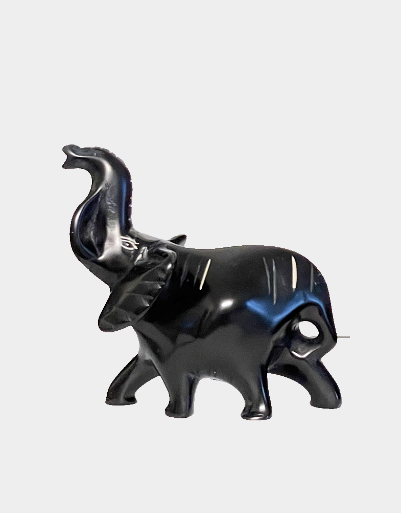 Kenyan artisans portray iconic trumpeting trunk up African elephants in a simplified sculpture with its trunk raised welcoming good luck. Free shipping! Buy now.