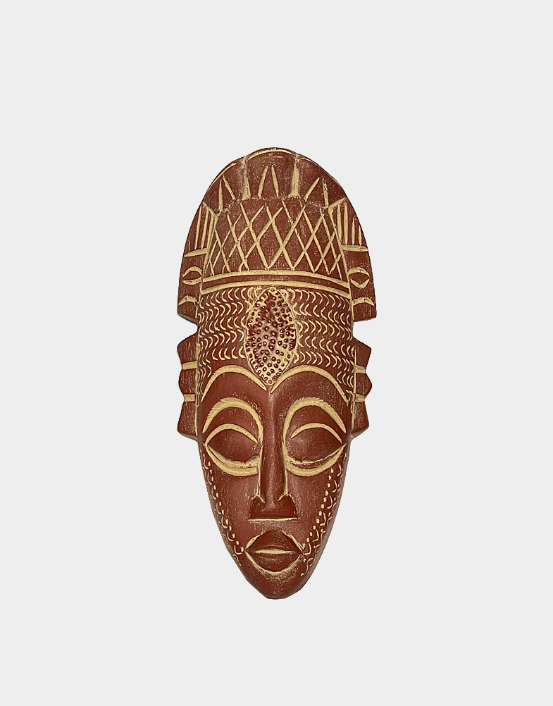 This African wall art piece is a wooden mask hand-curved by Victor Dushie with Ofuntum wood with marquise-shaped metal plate on the forehead. Made in Ghana.