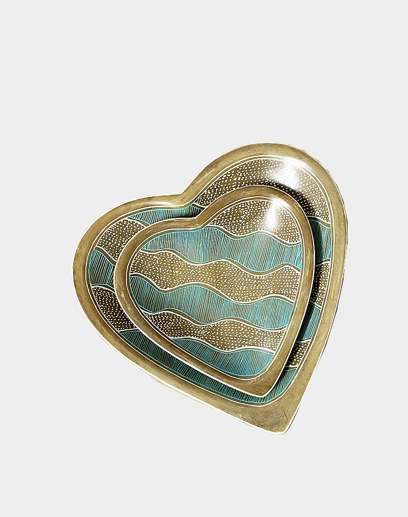 Kenyan artisans hand carve beautifully contoured heart-shaped nesting dish set from soft soapstone, then stain each piece with olive green and aqua blue dye.