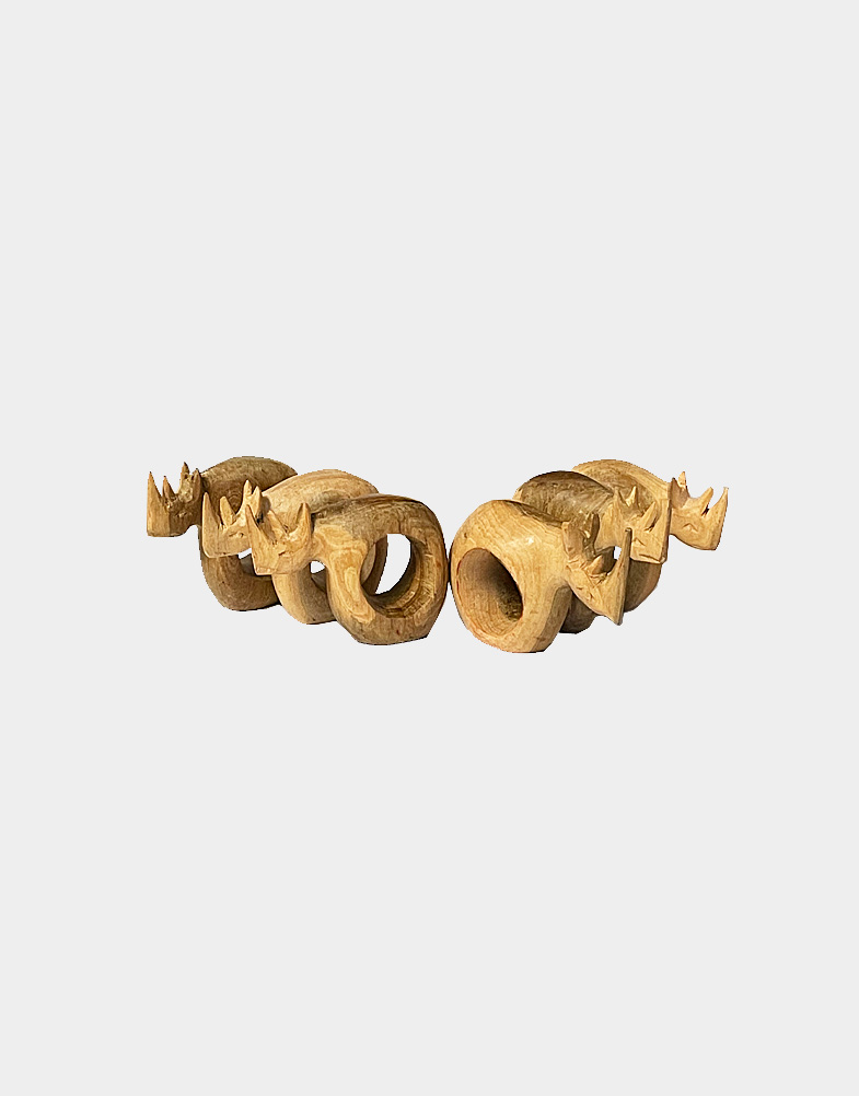 This set of six rhino napkin rings is carved from African Mahogany, using simple tools and traditional techniques Kenyan artisans. Free shipping!! Shop now!!