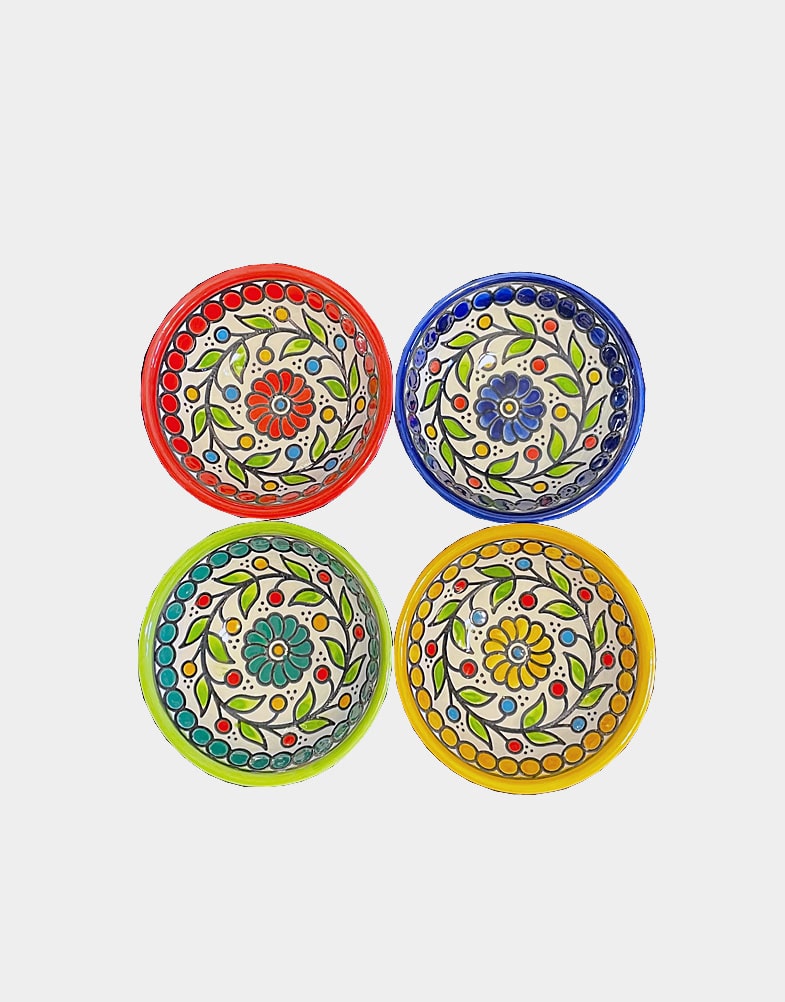 These beautiful ceramic dessert bowls set of four intricately hand-painted with a floral motif, reflects traditional Palestinian craft. Each bowl is hand painted.