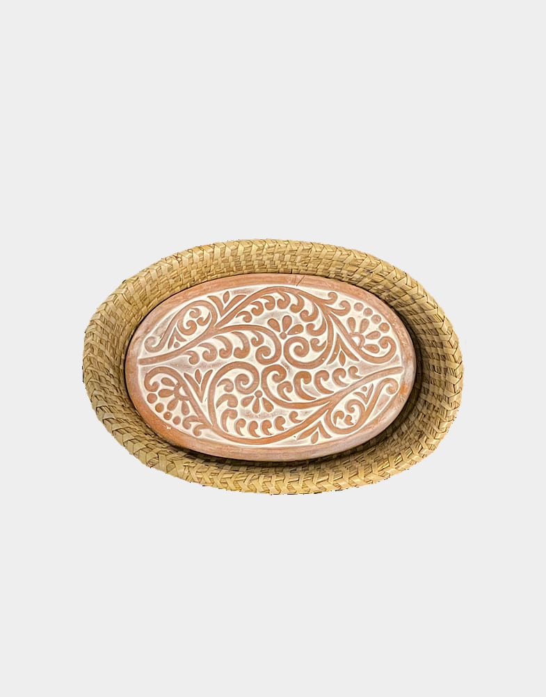 These beautiful terracotta stones are incised with an Indian-inspired motif design and sit within a handwoven kaisa grass basket. Warmer is oven safe. Buy now!