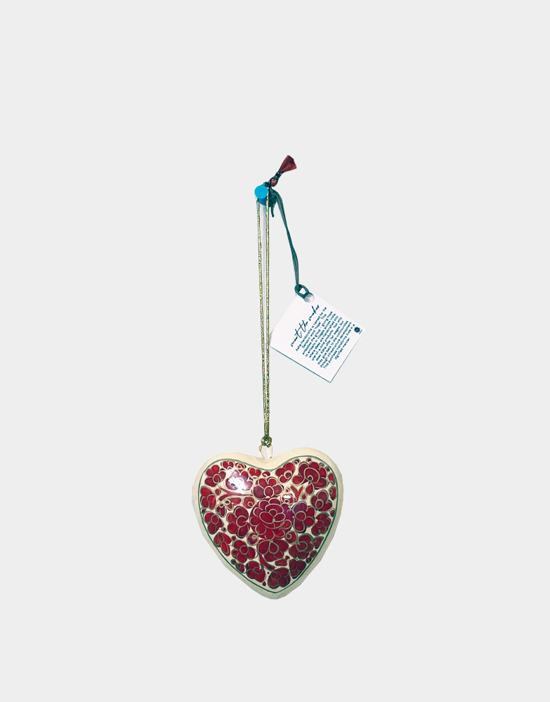 Beautiful hand painted, hand crafted heart shaped Christmas ornaments made of lighter papier mache easy to hang on trees for decoration. Collect now before it gone!