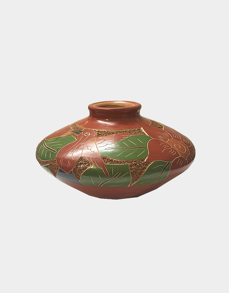 This vase from Nicaragua is 3.5 inches tall and 5 inches in diameter, featuring a bird in a relief design. This is low fired, not designed to hold water. Buy now!