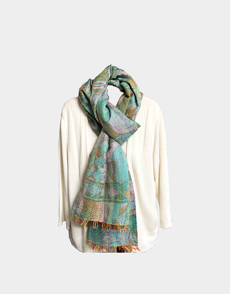 Based on the earthly colors, these vintage silk kantha scarves from Rajasthan, add warmth around your neck. The multicolor shades add a variety to the whole look.