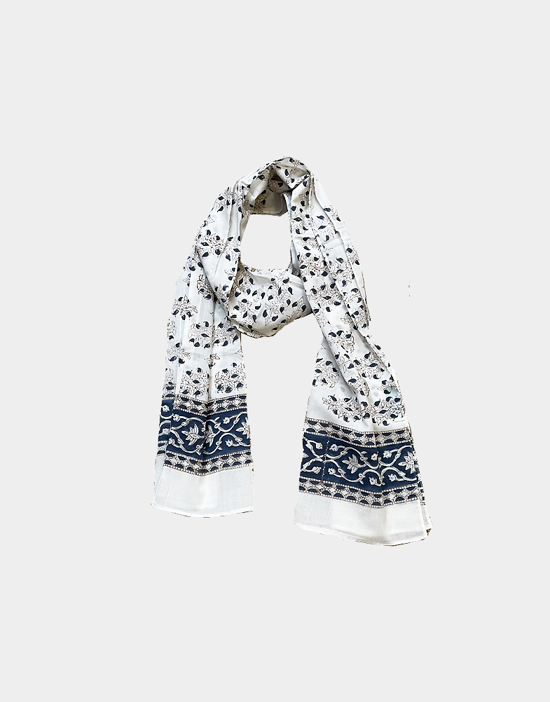 A light weight and ethically made cotton scarf that features a blue floral hand block print. This scarf is 100% cotton and hand block printed in India. Buy now!