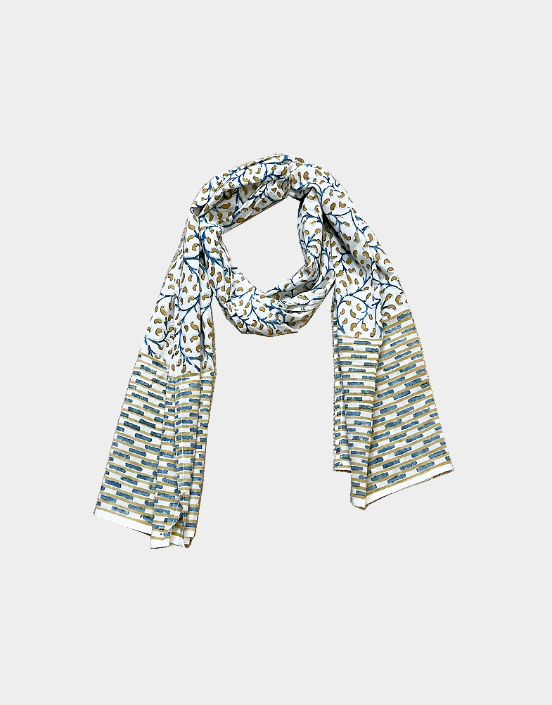 A light-weight and ethically made cotton scarf with a blue and yellow vine block print. This scarf is 100% cotton and hand block printed in India. Buy this scarf!!