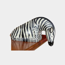 sitting zebra in stone